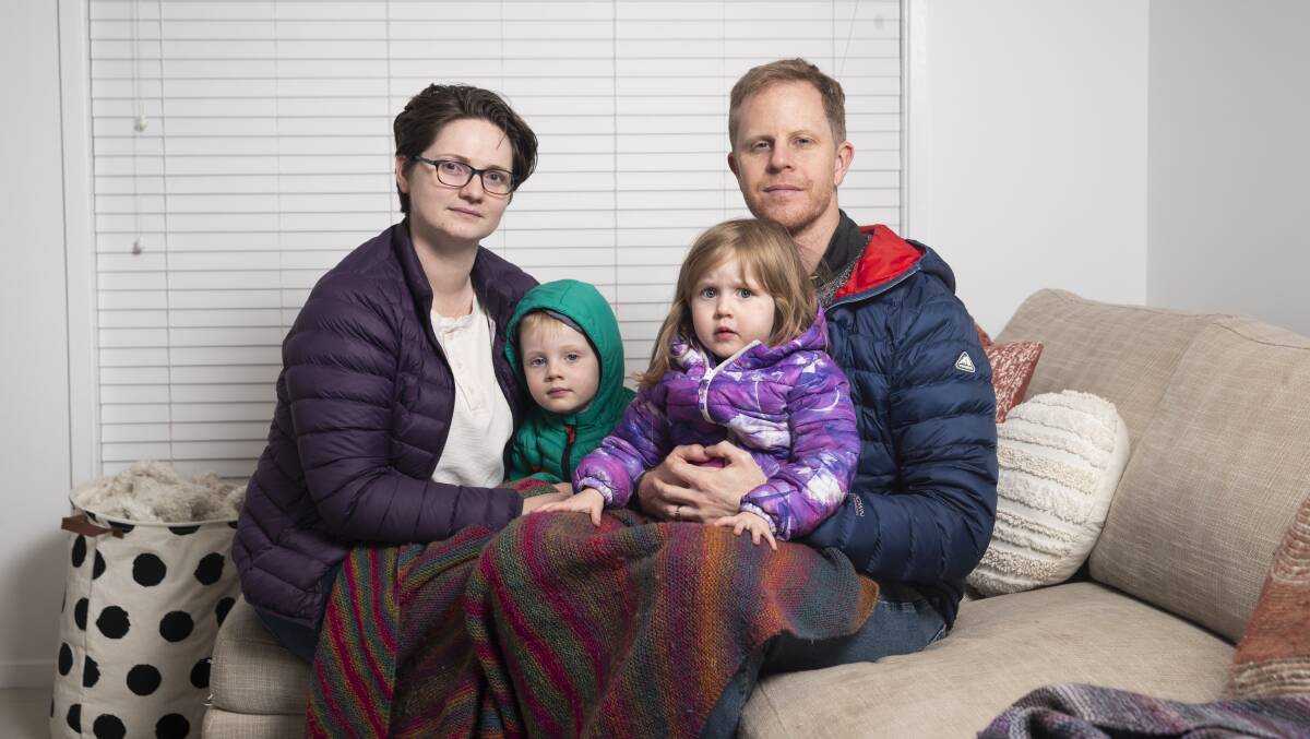 Caitlin and Mark Aspden, with their children Angus, 4, and Eleanor, 2, have tracked the temperature of their rental home over winter. Picture: Keegan Carroll