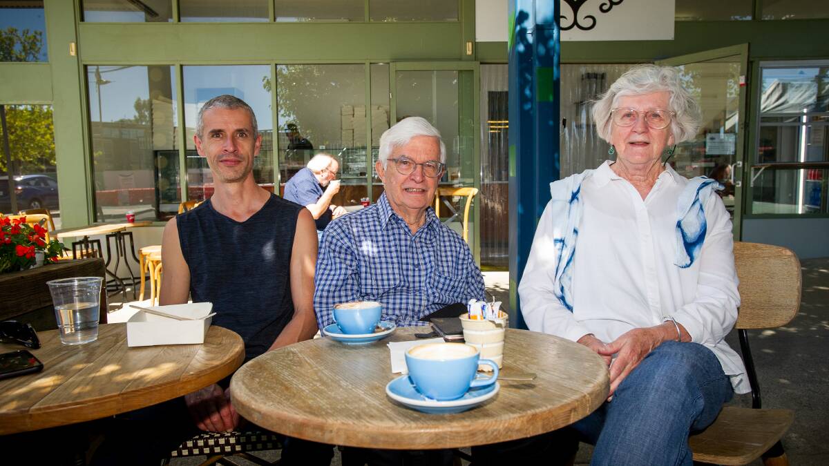 Ben, Rob and Faye Maron enjoying a coffee at the temporary Belconnen Fresh Food Markets on Friday. Picture by Eleza Kurtz