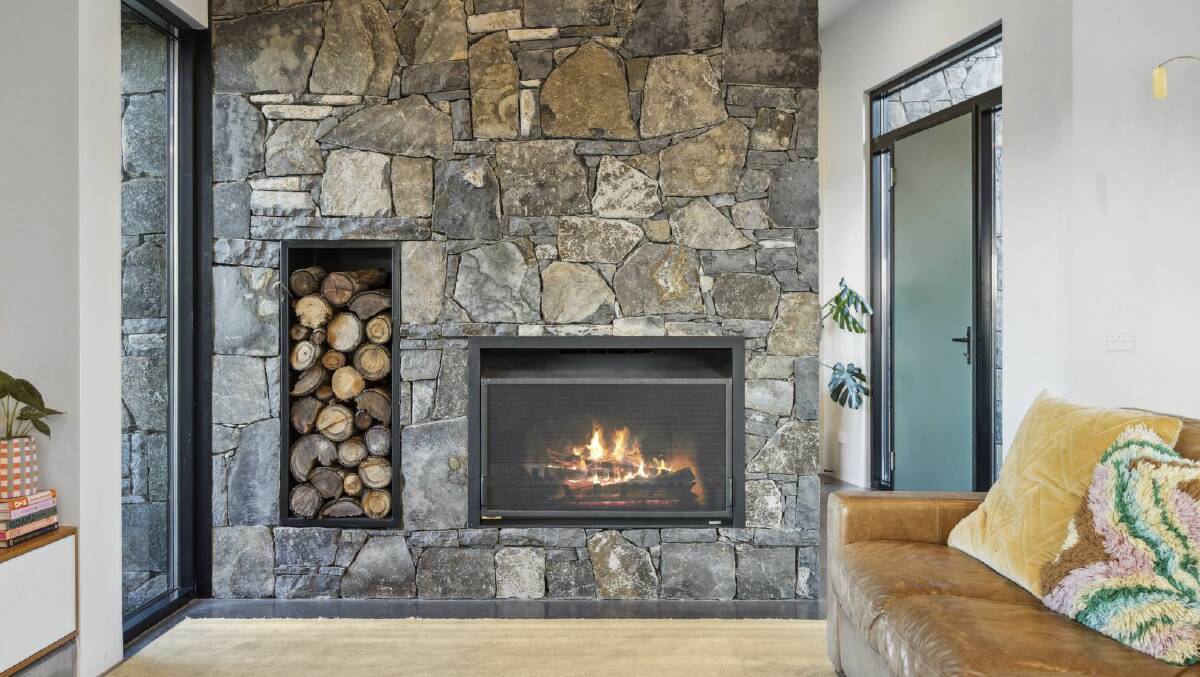 The home features a stone fireplace. Picture supplied