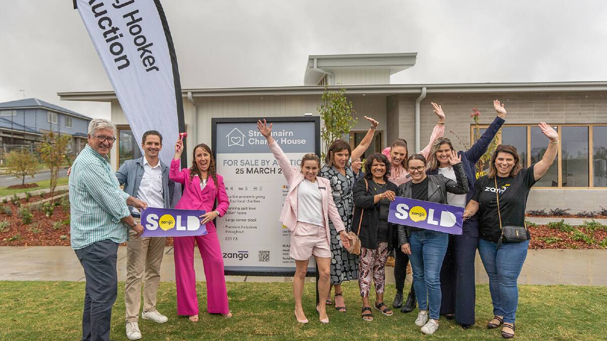Auctioneer Sandra Masters (third from left) pictured with the buyer and team behind the Strathnairn charity house. Picture Dan Cusack Photography