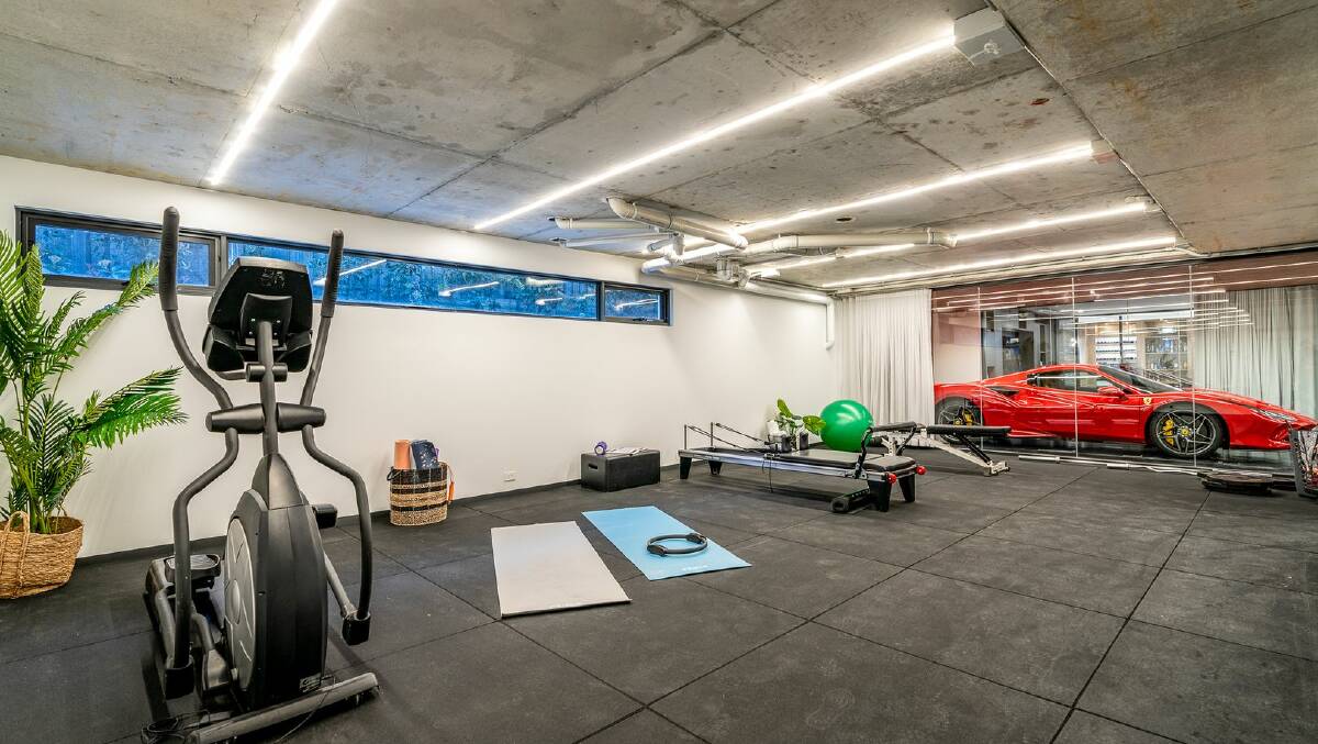 The basement level in this Griffith home features a car showroom and a gym. Picture supplied