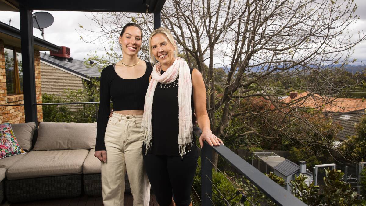 Donna Lee, right, and her daughter Ashlee Hooper at their Wanniassa home which is due to be auctioned in November. Picture by Keegan Carroll