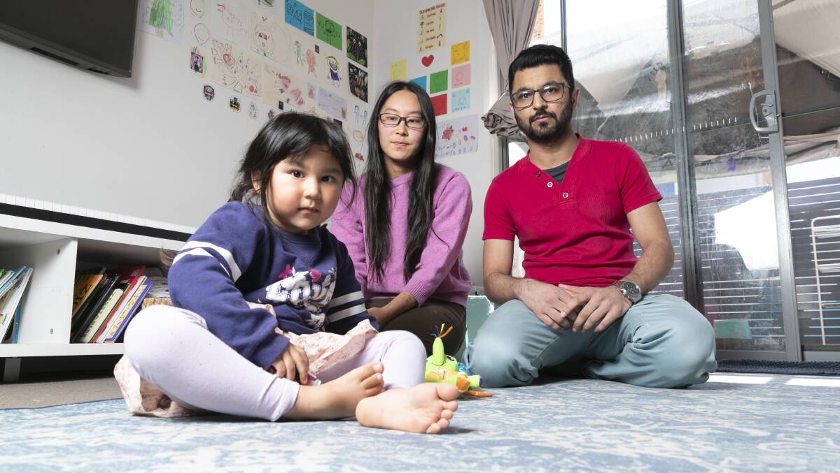 Najam Us Saqib pictured with his daughter Maeisha Najam, 3, and wife Risa Matsuda inside their Harrison apartment. Picture by Keegan Carroll
