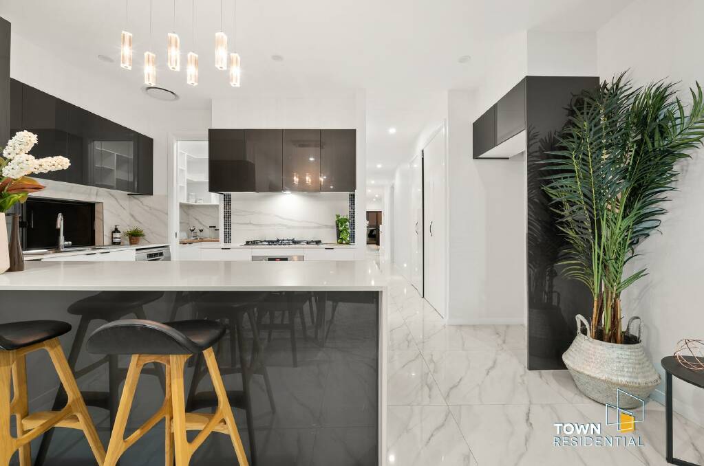 The new-build home features a modern kitchen with a walk-in pantry and stone benchtops. Picture: Supplied