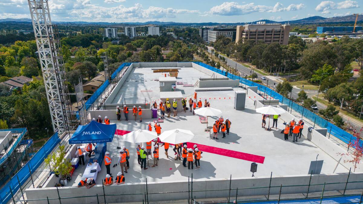 JWLand staff gathered to celebrate The Sullivan on Northbourne Avenue reaching a construction milestone. Picture supplied
