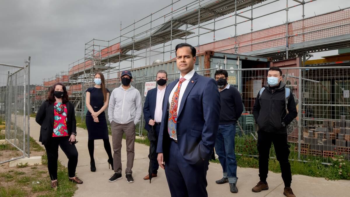 Lawyer Rahul Bedi, front, with clients Sheridan Burnett, Olga Zautner, Wasantha Davidlage, Reece Peart, Mohammad Choudhury and Song Le, who have all had their contracts cancelled by 3 Property Group. Picture: Sitthixay Ditthavong