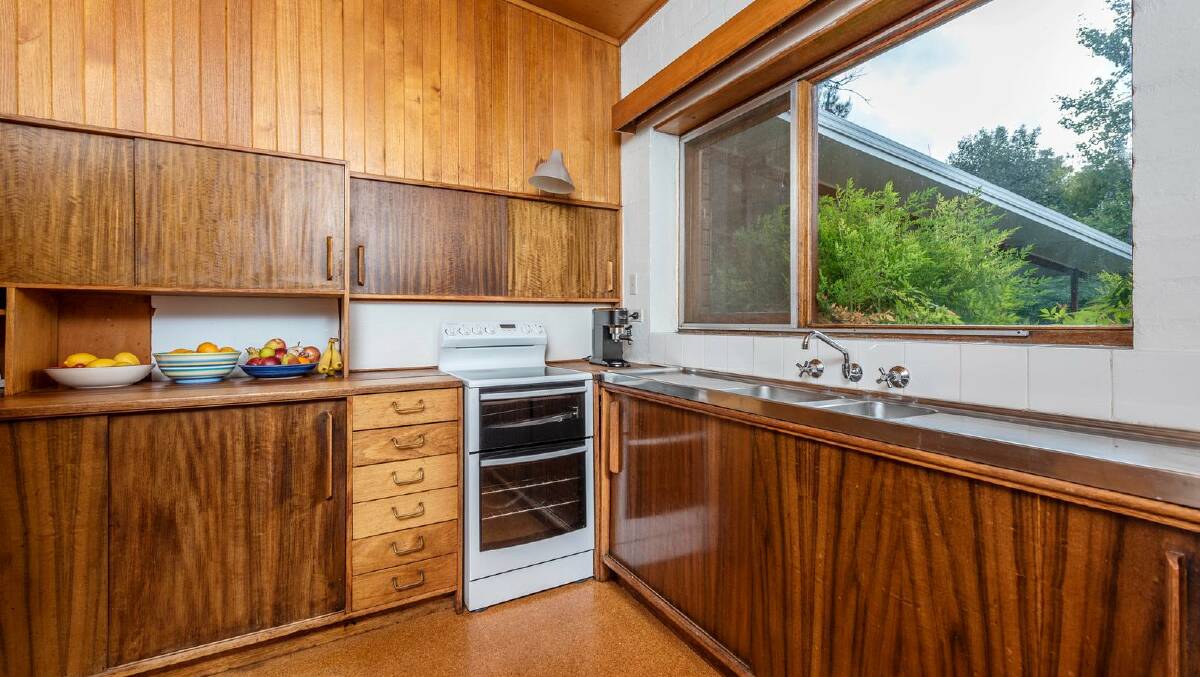 The house includes the original kitchen, as designed in the early 1960s. Picture: Belle Property Canberra