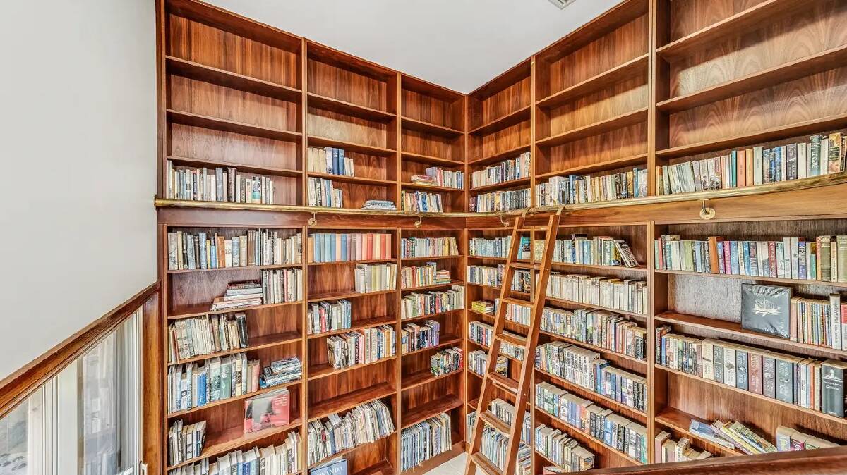 The floor-to-ceiling library was built to house the owners' collection of 4000 books. Picture supplied