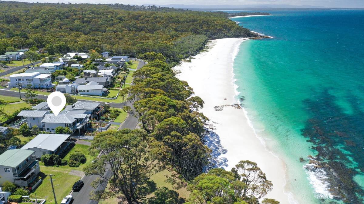 The home is located in a prime spot directly opposite Hyams Beach with views to Point Perpendicular and Bowen Island. Picture: Supplied