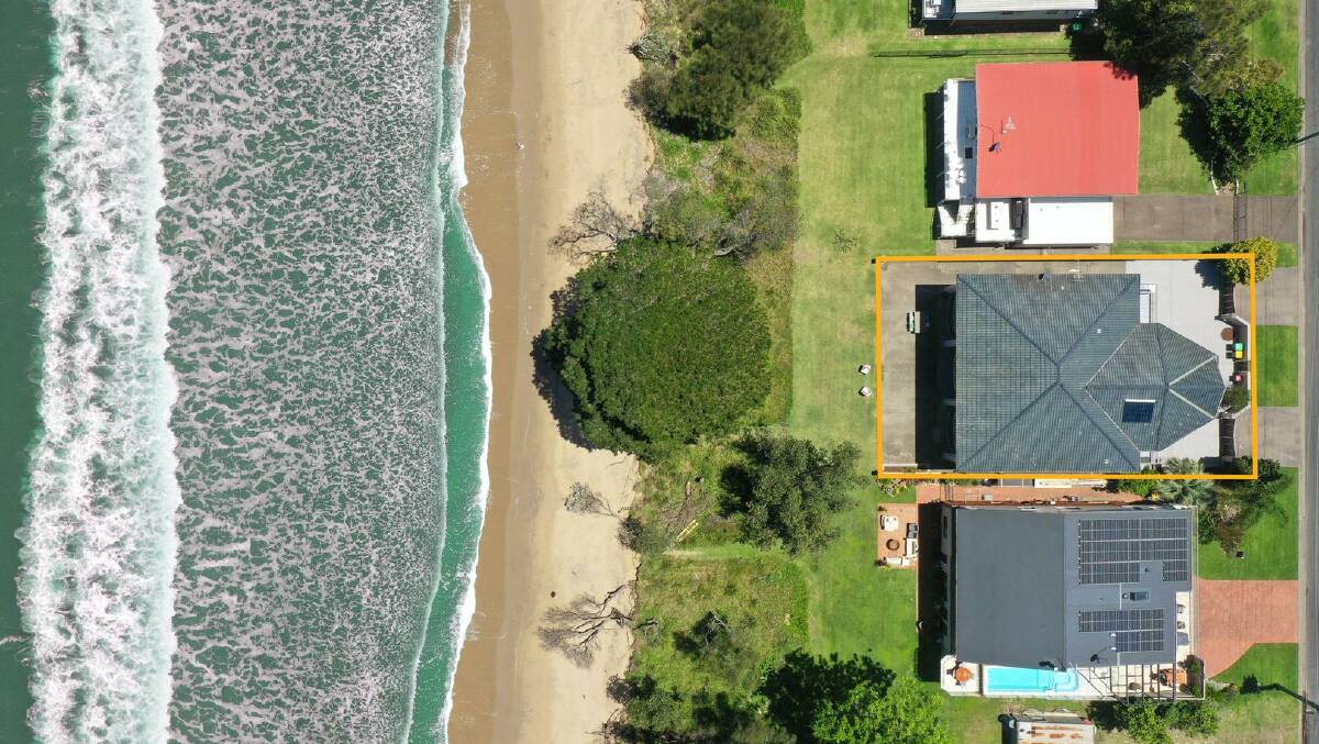 The four-bedroom house is located steps away from Surfside Beach. Picture: Raine & Horne Batemans Bay