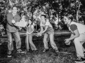 Kate Parkinson, 11, Alison Bramley, 7, Nina Stanwell, 9, and Penny Collins-Williamson, 11, play cricket.