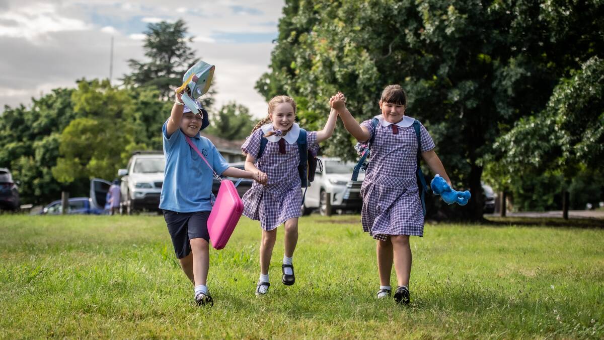 First day of 2022 for kids attending St Bede's Primary School in Red Hill. Year 5 besties (from left) Sophia Grutt, Zalia Novakovic and Georgia Torline have been counting the days until their return to school. Picture: Karleen Minney