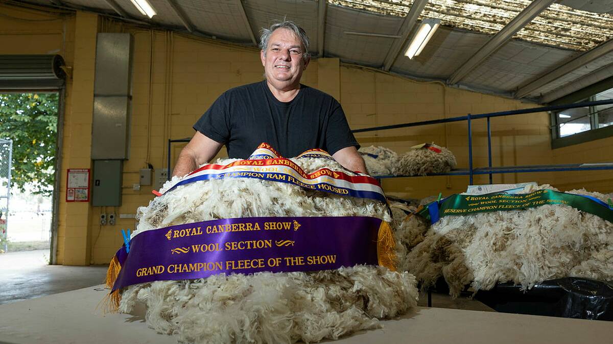 Chief wool steward Stuart Sutherland with the show's grand champion fleece. Picture by Keegan Carroll