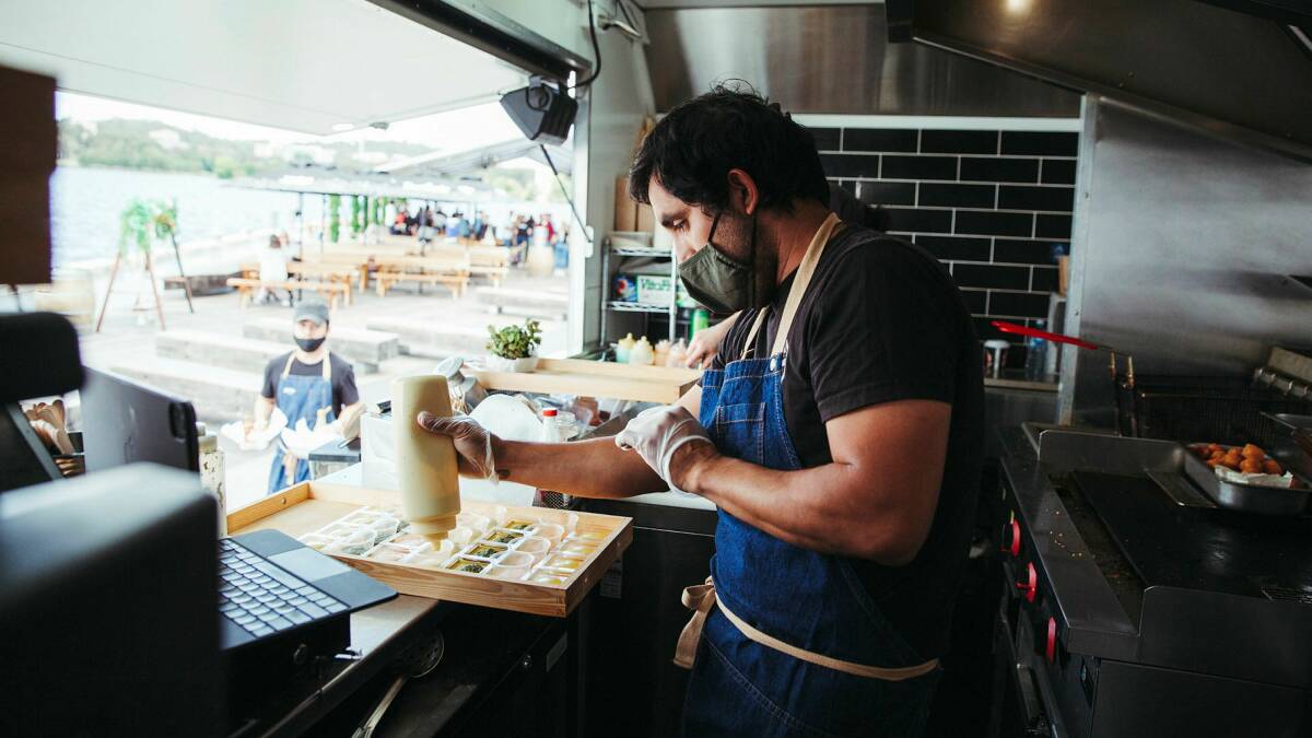 Owner of Mr Papa Restaurant Carlos Ramirez working at his food truck. Picture: Dion Georgopoulos