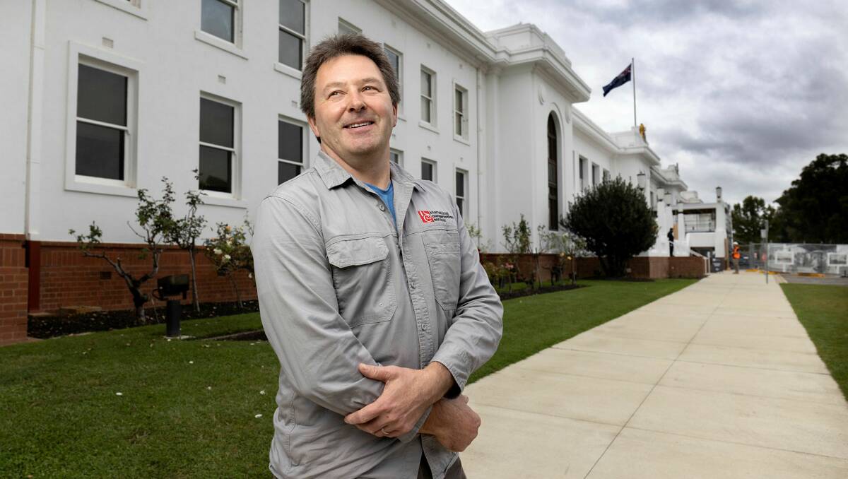 Doug Rogan outside Old Parliament House, which he helped restore after it was set on fire. Picture: James Croucher