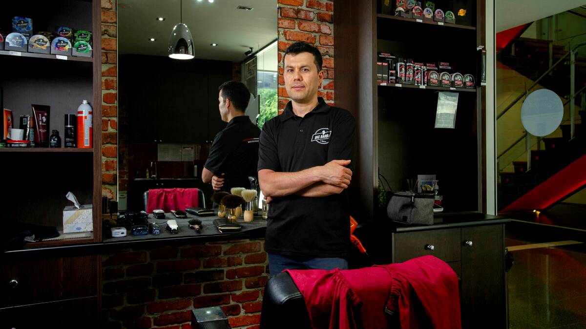 Franchise owner of three Big Barber stores in Canberra, Jasur Qaimov, has been struggling to find workers for a year and a half. Picture by Elesa Kurtz