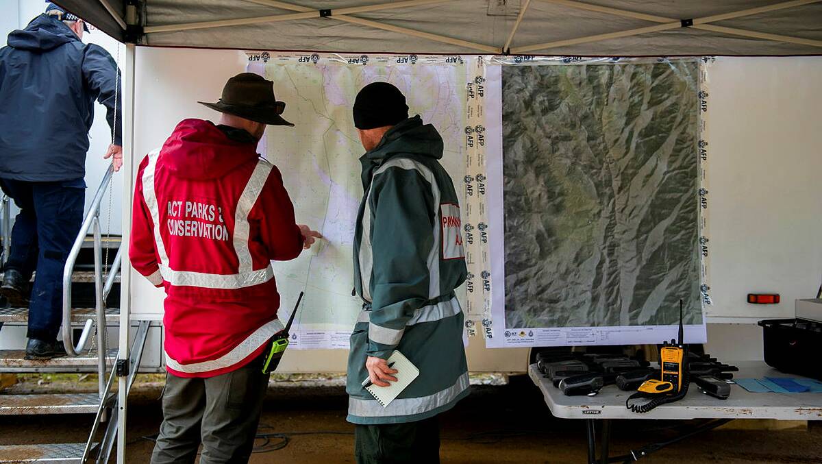 Parks and Conversation workers mapping at the police search and rescue training exercise at Namadgi National Park. Picture by Elesa Kurtz