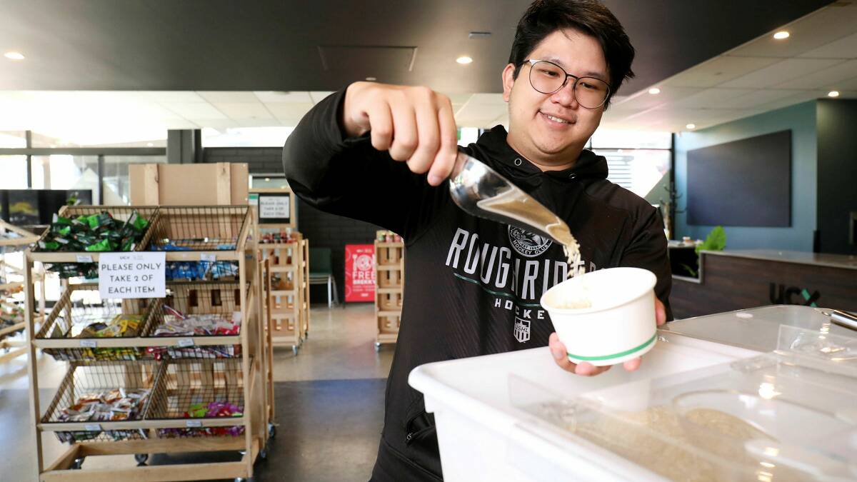 University of Canberra student Christopher Wong shopping at the university's Food Pantry. Picture by James Croucher