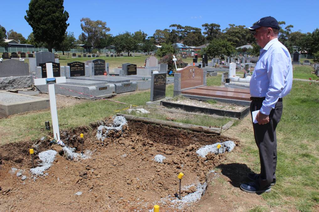 Dennis Ness at the foot of James' grave.Picture by Jenny Denton