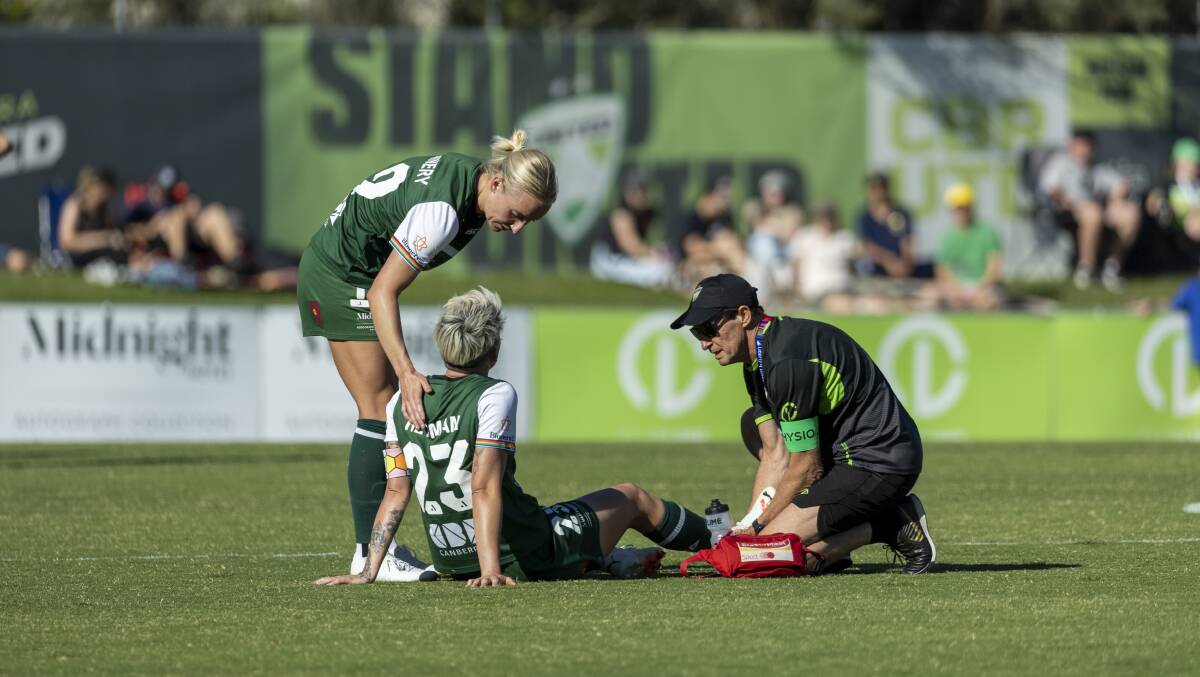 Michelle Heyman receives medical attention for an ankle knock. Picture by Gary Ramage