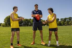 Men's AFL Canberra Under-22 coach Anthony Bourke with Jordan Gilbert and Thomas Simpson. Picture by Gary Ramage