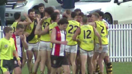 Tigers players swamp their skipper Aidan Bowyer after his goal. Picture All In Sports