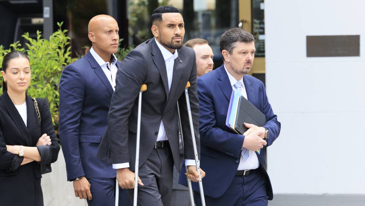Tennis star Nick Kyrgios arrived at court on Friday with crutches following knee surgery. Picture by Keegan Carroll