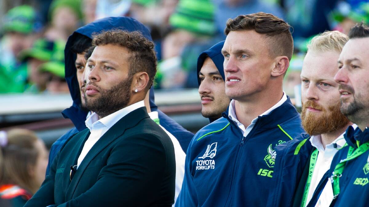 Sebastian Kris and Jack Wighton watch the Raiders play the Bulldogs from the sidelines last weekend. Picture by Elesa Kurtz