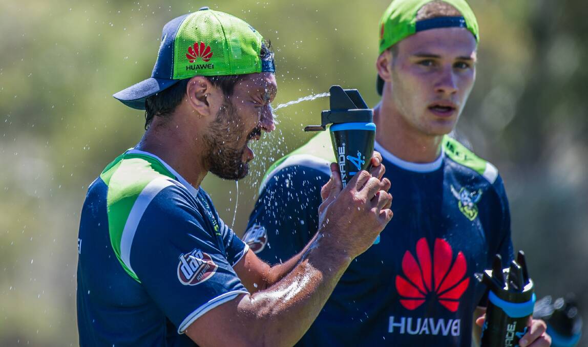 Raiders players try to cool down in steaming hot conditions. Picture by Karleen Minney