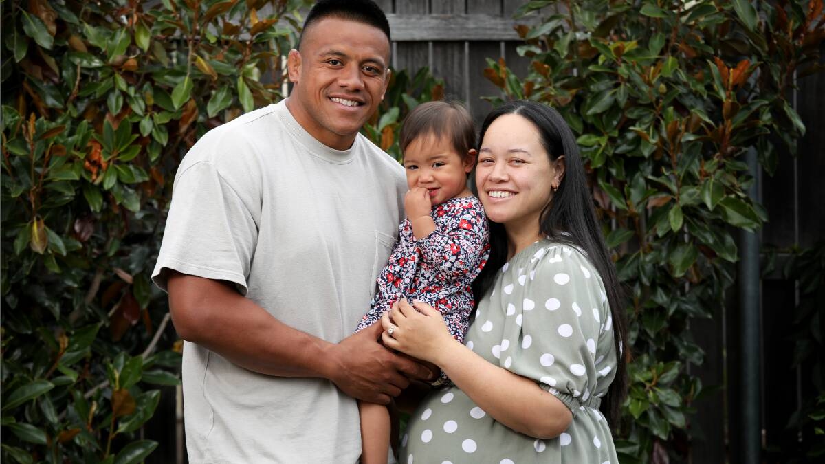 Allan Alaalatoa at home with his wife Filo, and daughter Niah. Picture by James Croucher