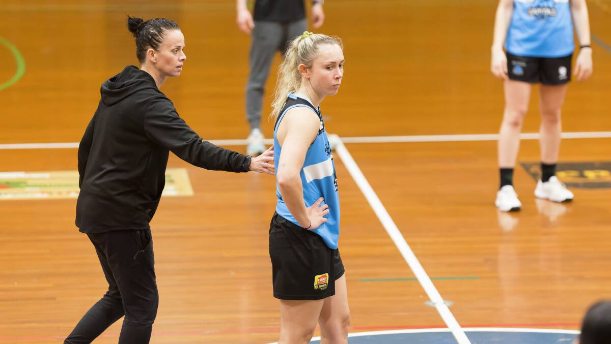 Canberra Capitals coach Kristen Veal with Elizabeth Tonks at training. Picture by Sitthixay Ditthavong