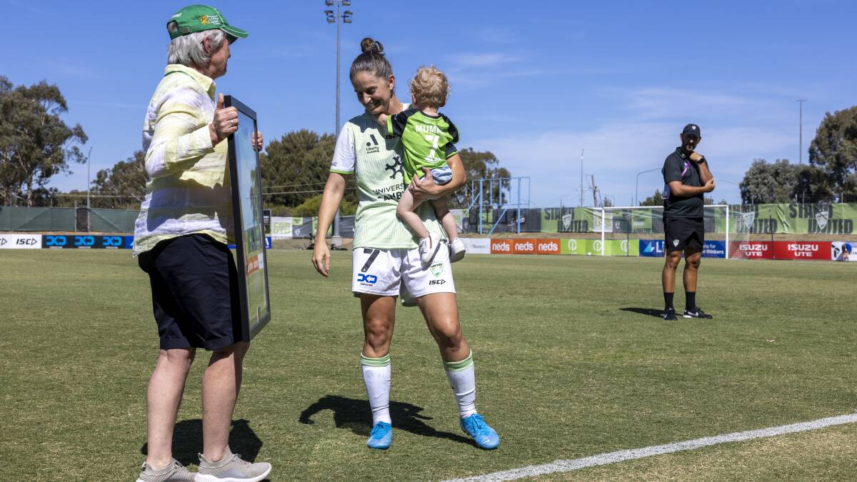 Heather Reid was in town on the weekend to present veteran Ellie Brush a commemorative jersey in her final home game before retiring at the end of the season. Picture by Keegan Carroll