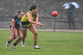 Wet and wild weather during AFL Canberra's opening week last month. Picture by Elesa Kurtz