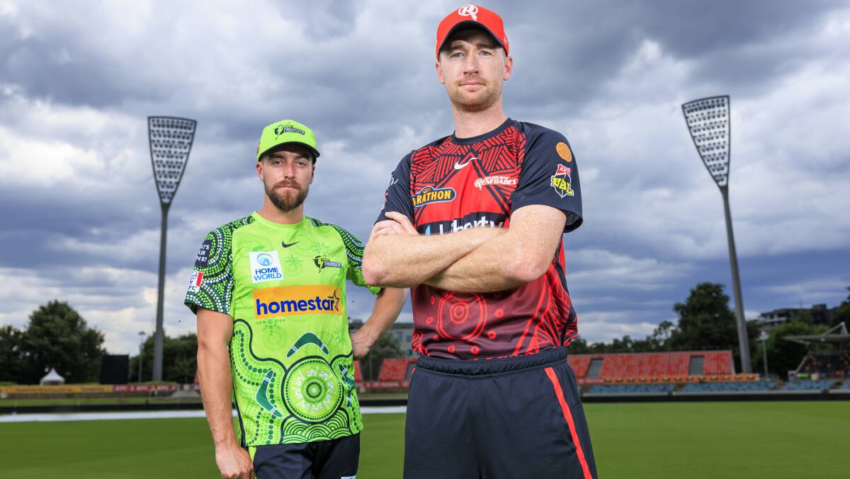 Tom Rogers from the Melbourne Renegades and Alex Ross from the Sydney Thunder at Manuka Oval. Picture by Keegan Carroll