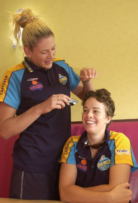 Former Canberra Capitals teammates Lauren Jackson and Kristen Veal. Picture by Melissa Stiles