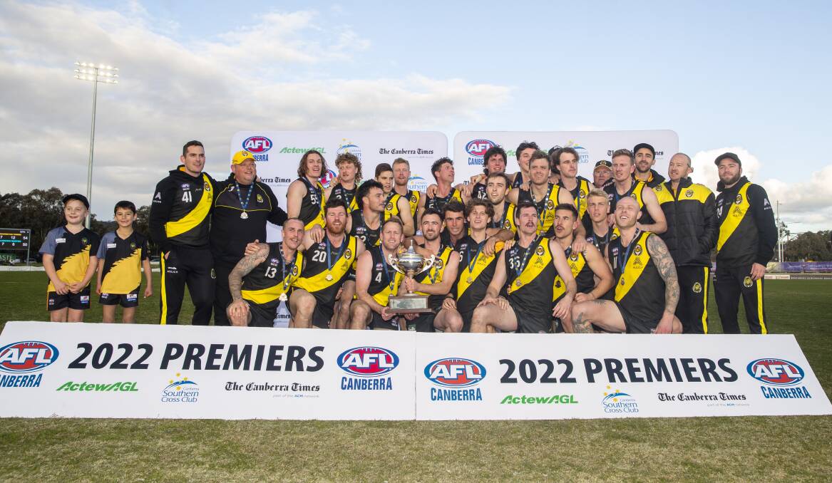 The Tigers celebrate after winning the premiership. Picture: Keegan Carroll