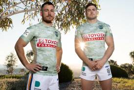 Tom Starling and Hudson Young wearing the ANZAC Round Raiders jerseys at the National Arboretum near the Forest of Remembrance. Picture by Sam Gibson/Raiders