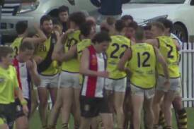 Tigers players swamp their skipper Aidan Bowyer after his goal. Picture All In Sports