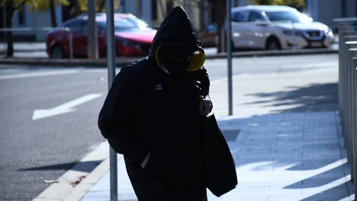 Richard Lucas arrives at court on another occasion, covering himself up from head to toe. Picture by Tim Piccione