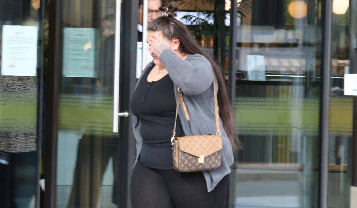 Rebecca Parlov covers her face as she leaves court on Friday. Picture by Tim Piccione 