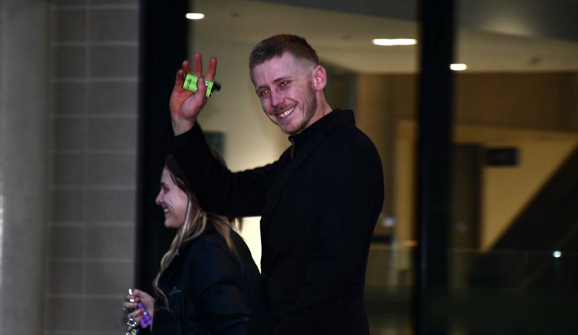Aiden Paff waves at a media camera as he leaves court in June. Picture by Tim Piccione 