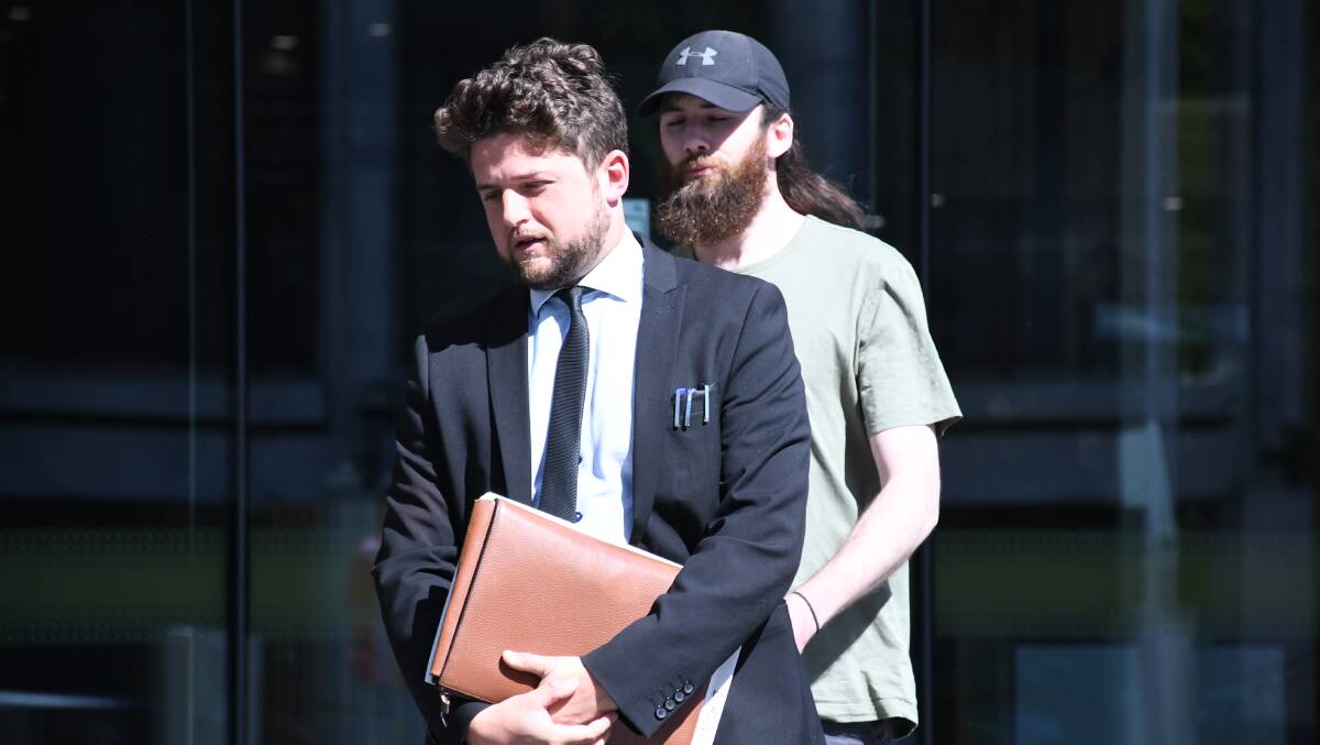 James Lynch, right, attempts to hide behind Legal Aid lawyer Jeremy Banwell. Picture by Tim Piccione 