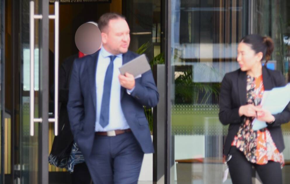 Luke McCaghey leaves court on Wednesday with defence lawyer Satomi Hamon. Picture by Tim Piccione 