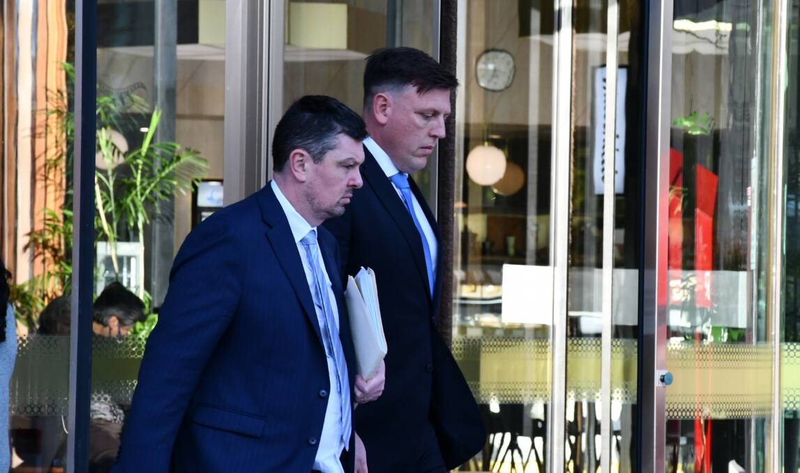 Shayne Taylor, right, leaves court on Monday with defence lawyer Michael Kukulies-Smith. Picture by Tim Piccione
