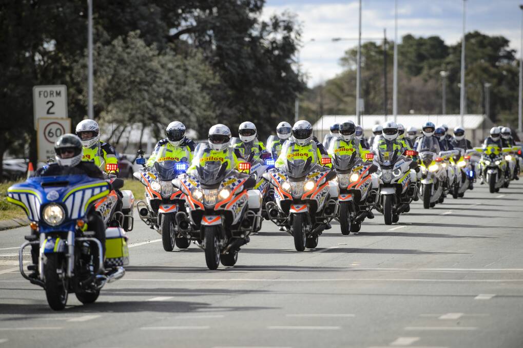 A long convoy of motorbikes makes its way down Northbourne Avenue during the 2017 Wall to Wall Ride for Remembrance. Picture by Sitthixay Ditthavong