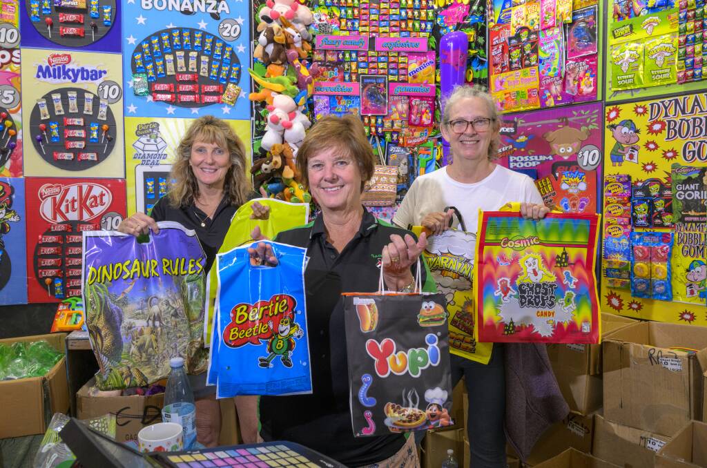Denise Patrick, Melinda Whitby and Careena Turrell sell show bags at the Royal Canberra Show. Picture by Keegan Carroll