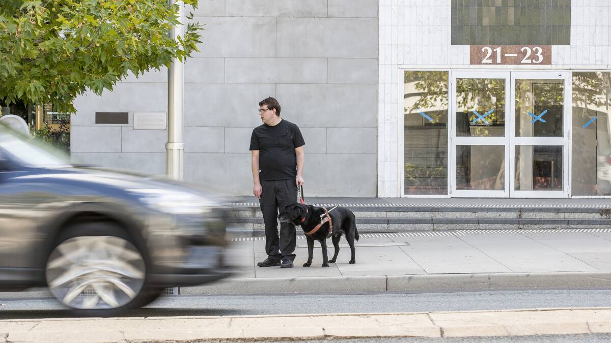 Other residents have spoken up in the past about being denied Uber rides, such as Daniel and his service dog Jake pictured here. Picture by Sitthixay Ditthavong
