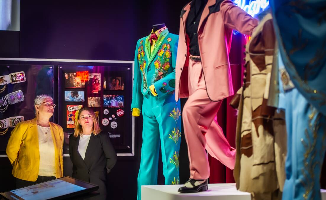 Costumes from the Baz Luhrmann Elvis movie on exhibition at the National Film and Sound Archive in 2022 as curators Gayle Lake and Tara Marynowski look on. Picture by Karleen Minney