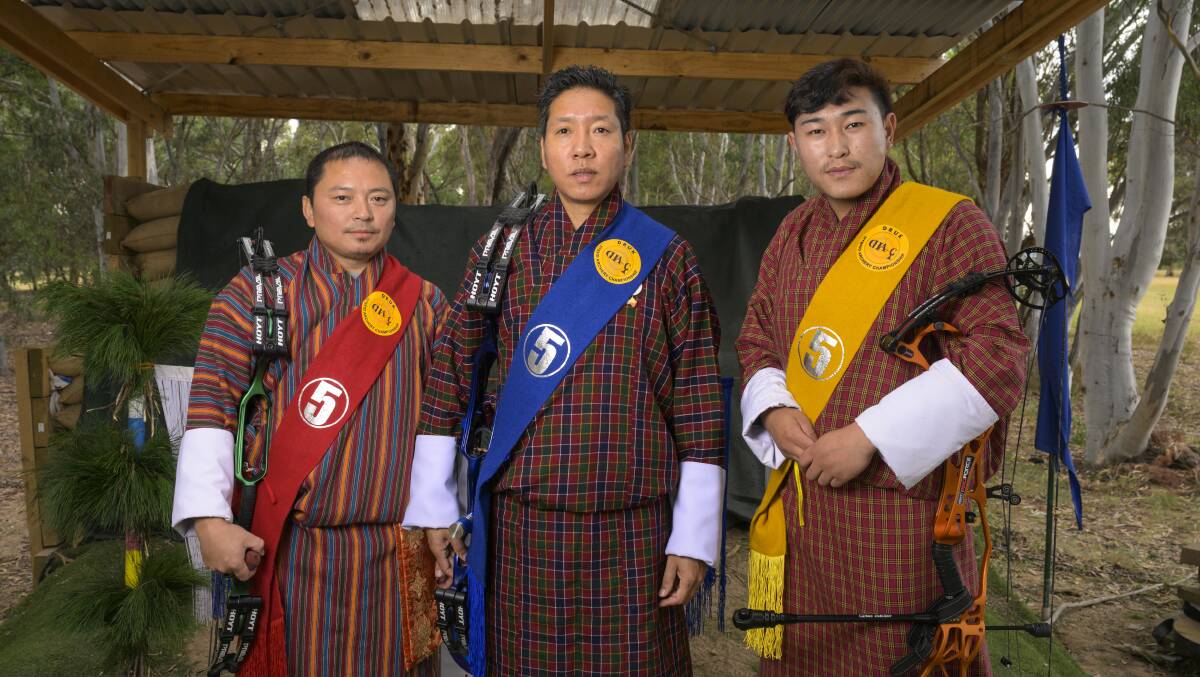 Yeshi Pelzang, Passang and Kinley Wangchuk dressed in the traditional Bhutanese dress 'Gho'. Picture by Keegan Carroll