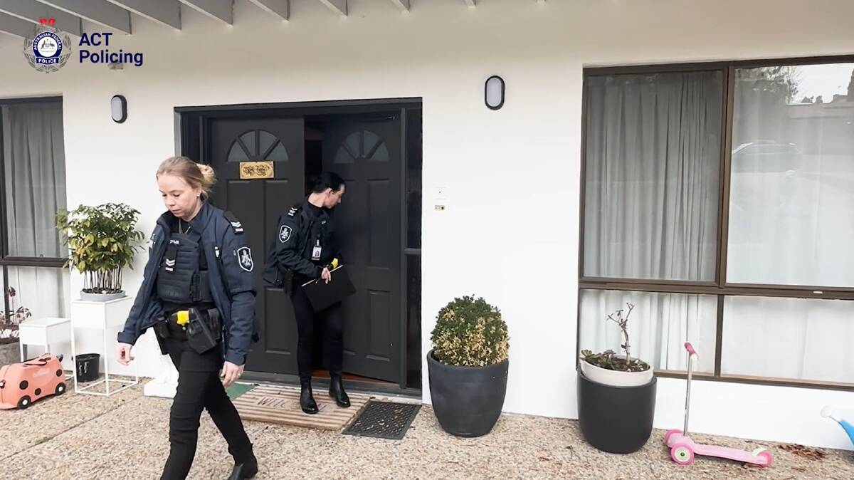 Officers from ACT Policing's sexual assault and child abuse team at the O'Malley home were the alleged victim of human trafficking was found. Picture via ACT Policing
